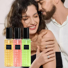 A man in a white shirt embraces a smiling woman. In the foreground, three colorful Rivet Series Fresh Perfume bottles—woody, fruity, floral fragrances for ladies—are displayed in yellow, pink, and green.