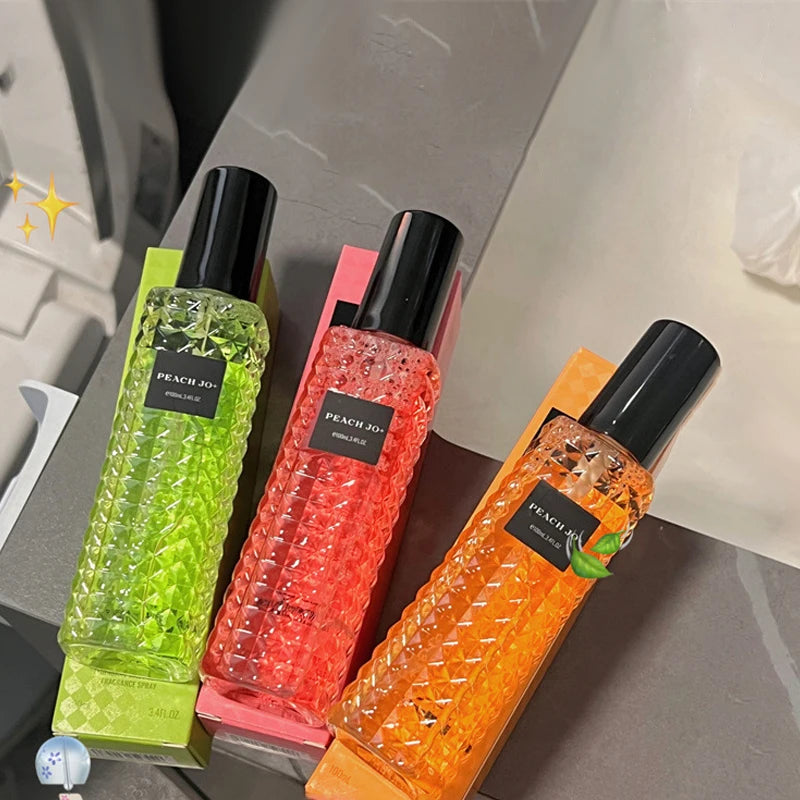 The Rivet Series Fresh Perfume offers three textured glass bottles in green, pink, and orange—each with a black cap and Peach 3D label—featuring long-lasting, alcohol-free woody, fruity, and floral scents for women.