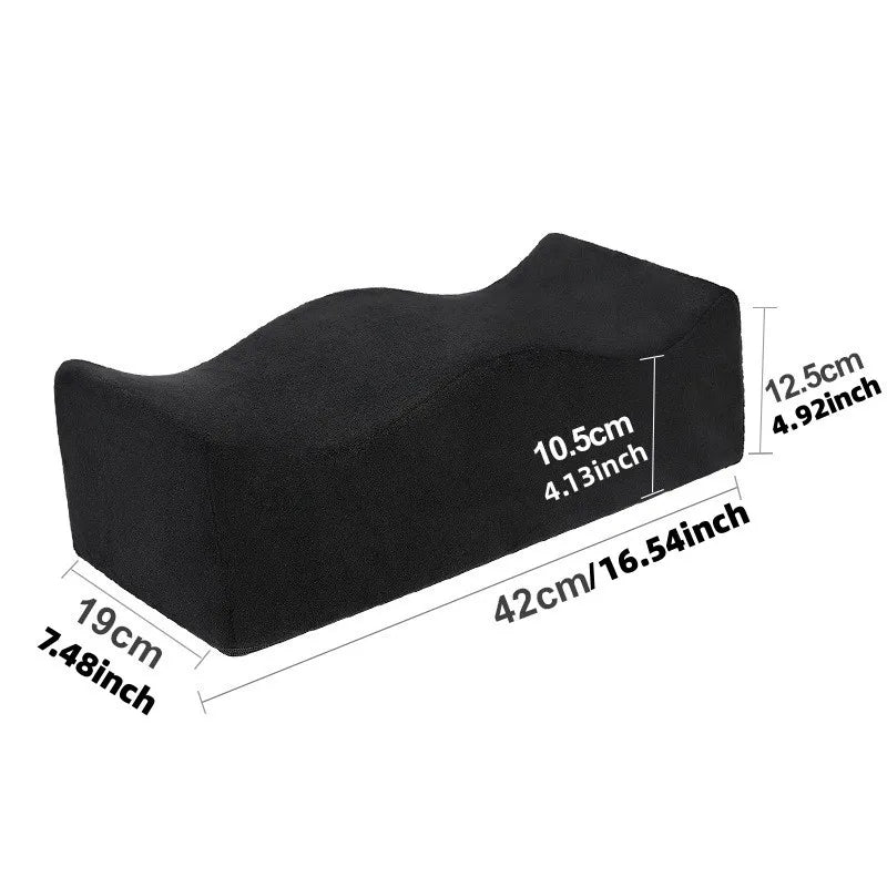 The BBL Pillow Seat Pad is a black ergonomic foam buttock cushion, crafted from plush fabric with a removable, washable cover. It measures 42×19 cm, height 12.5 cm (end)/10.5 cm (center), ideal for hip surgery recovery comfort.