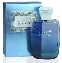 A blue bottle of RASASI Hawas Men's Ice Eau De Parfum 100ml stands before its matching blue and silver box with Arabic and English text. The white-capped bottle contains 3.4oz of fragrance for men.