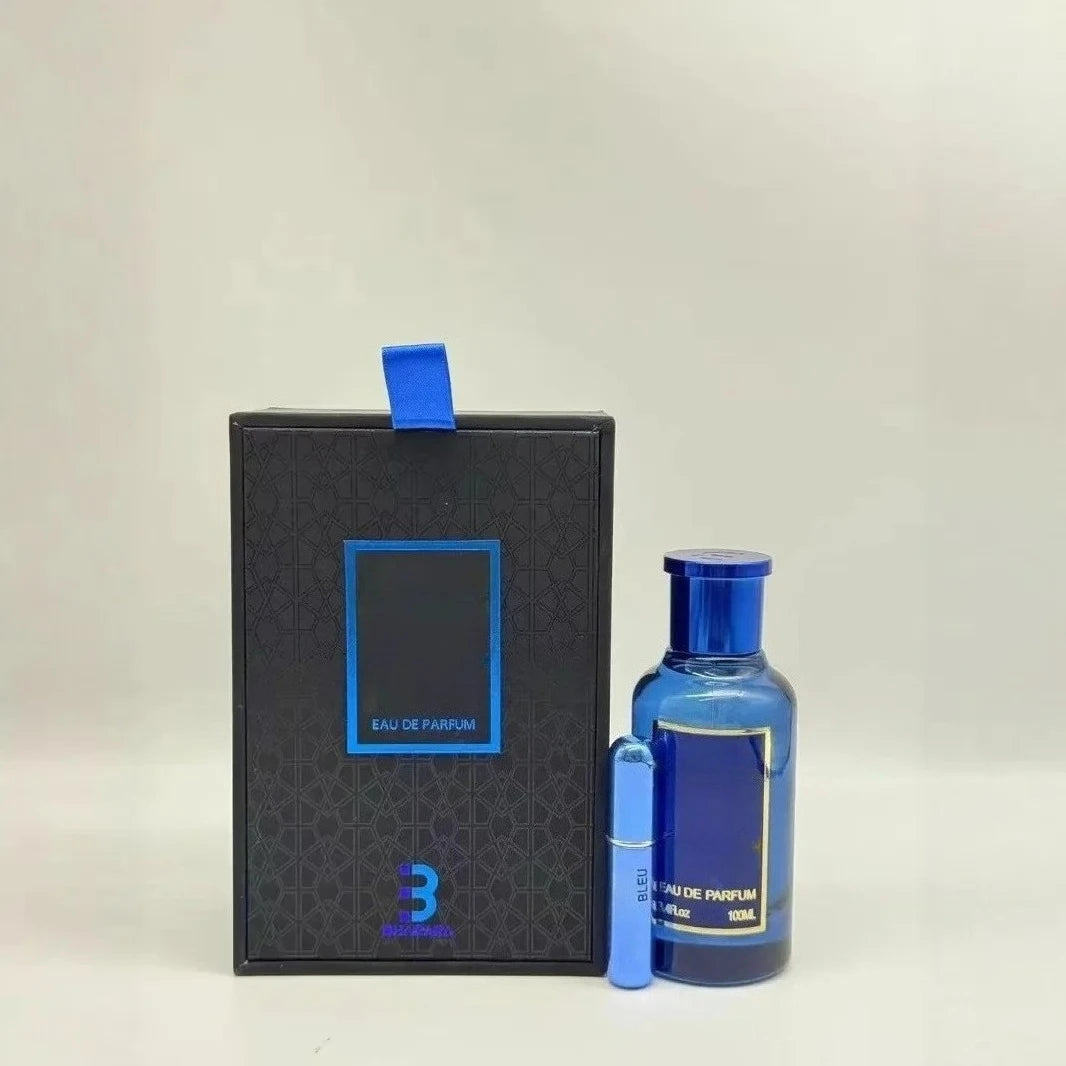 A blue perfume bottle, small sample vial, and a black gift box with blue accents and ribbon labeled "100ML Eau De Parfum For Men 3.4 Oz" are displayed on a light background, highlighting this high-end, sealed perfume gift set.