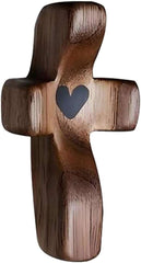 Small handheld wooden cross with heart cutout for fingertip stress relief and encouragement gift, made of natural black walnut.