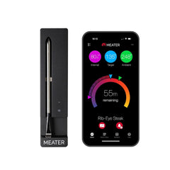 Wireless smart meat thermometer with Bluetooth and black charger next to smartphone app showing cooking progress