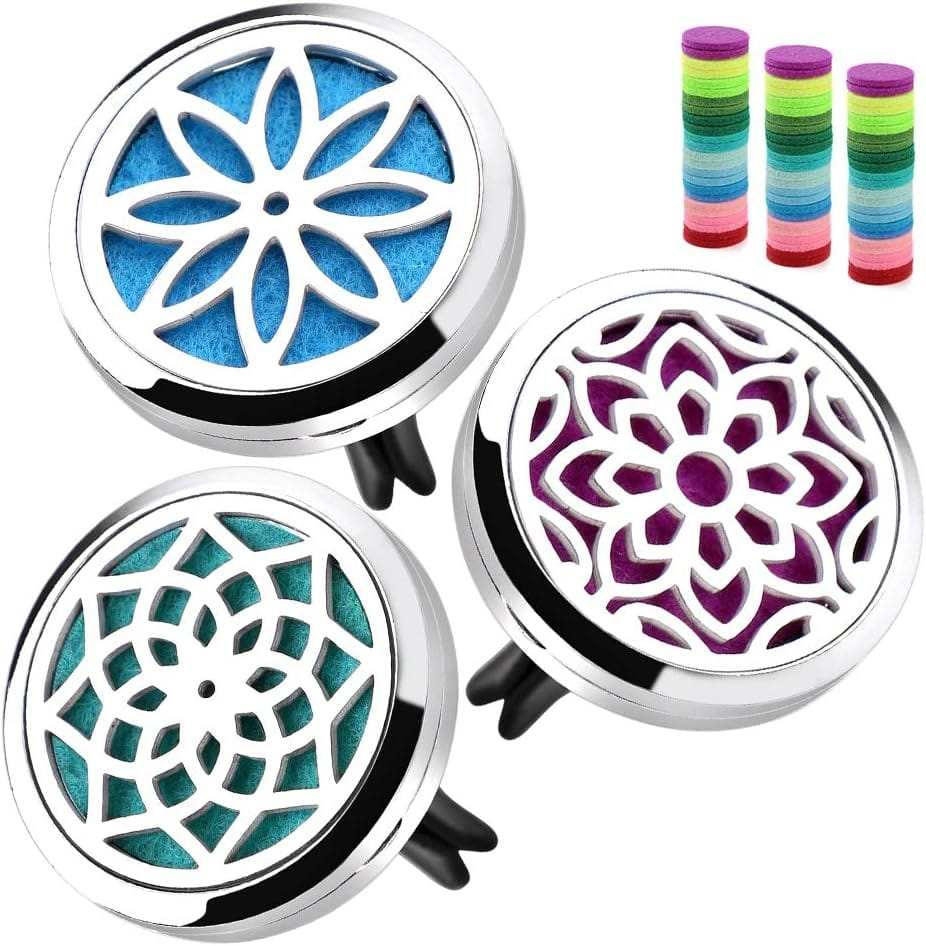 Car diffuser vent clip set with metal alloy hollow lotus designs and 36 colorful refill pads for aromatherapy in car vents.