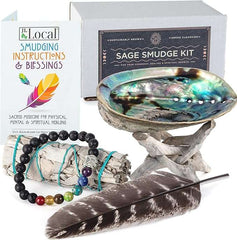 White Sage Smudging Kit with abalone shell, feather, chakra bracelet, wood stand, and instruction booklet for cleansing and spiritual healing